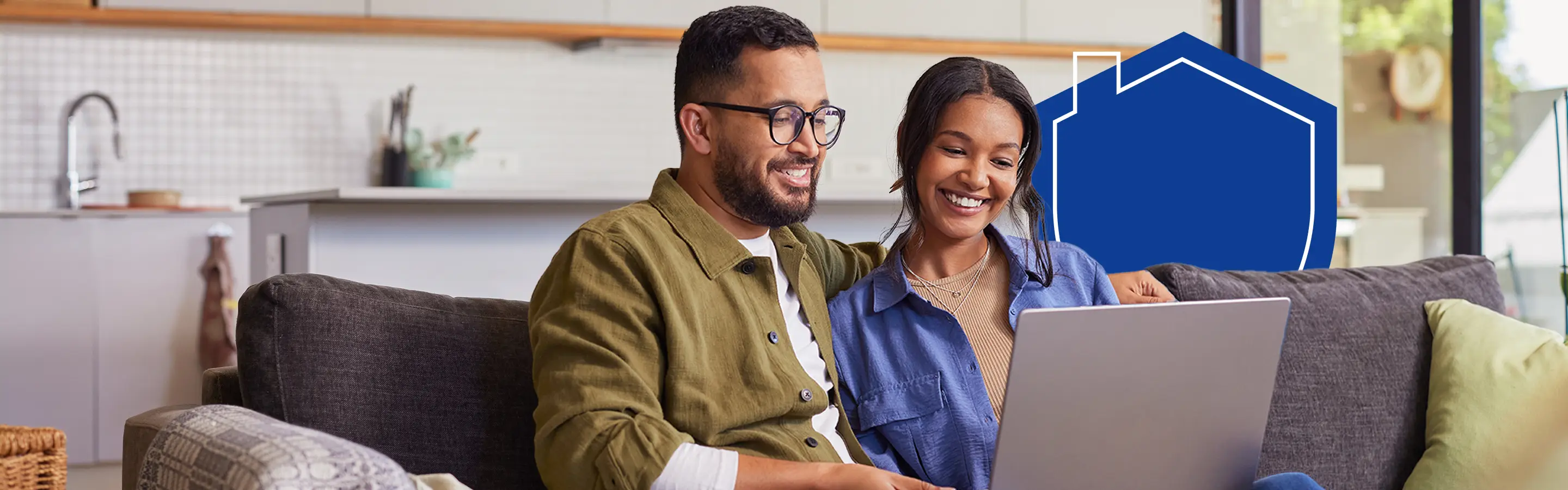 Happy couple looking at laptop screen Happy couple looking at laptop screen