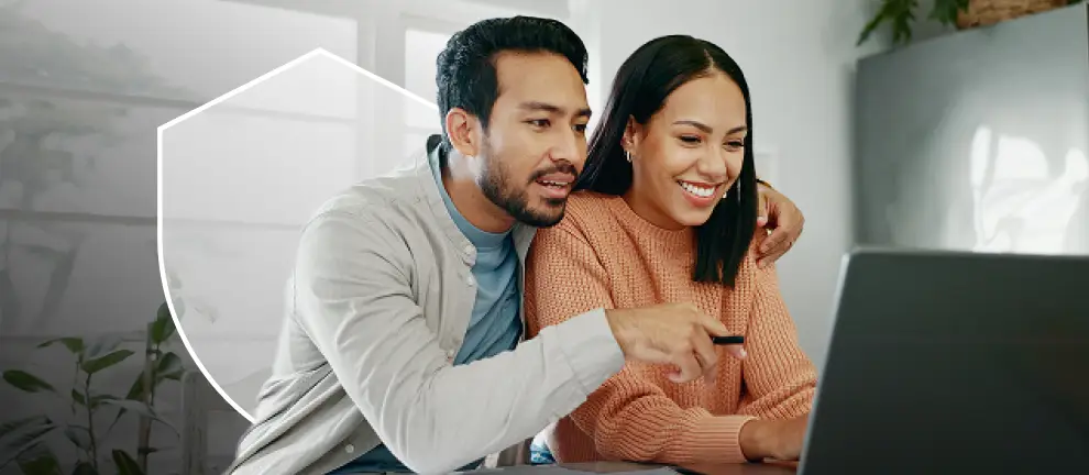 Couple researching home warranty online