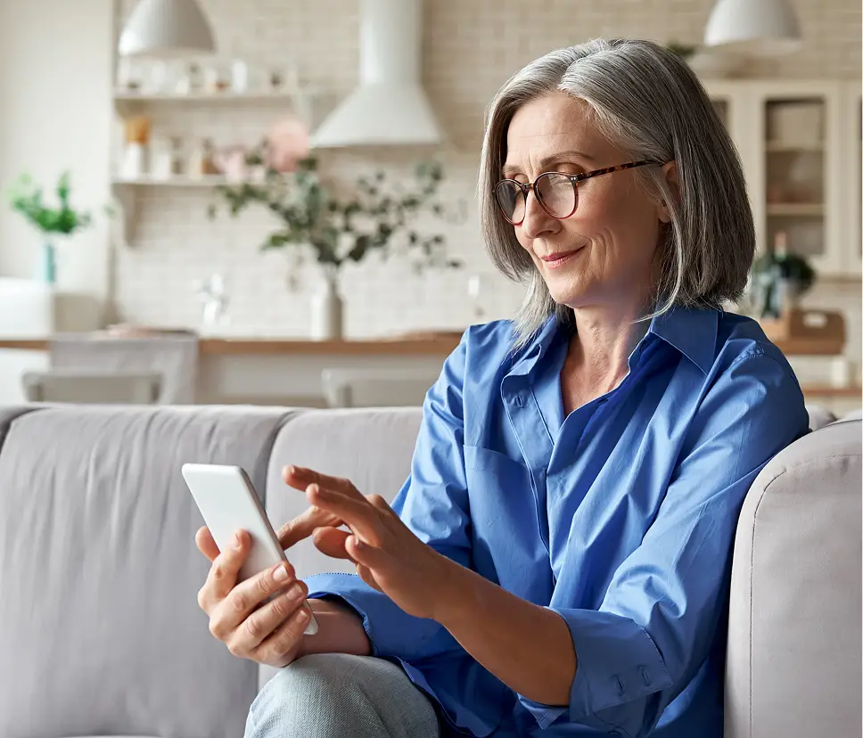 Woman using smartphone for home warranty options