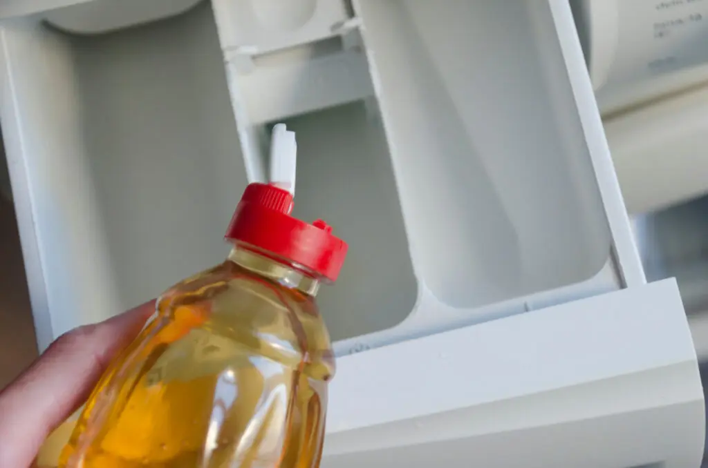 Vinegar in washing machine detergent tray. 